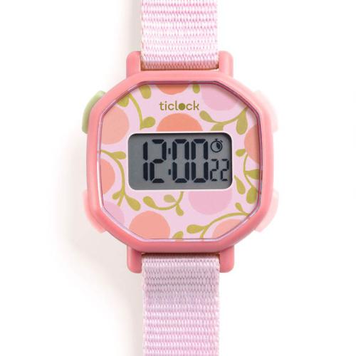 Relógio de pulso digital Djeco rosa para criança, com mostrador de padrão floral e bracelete em tecido.