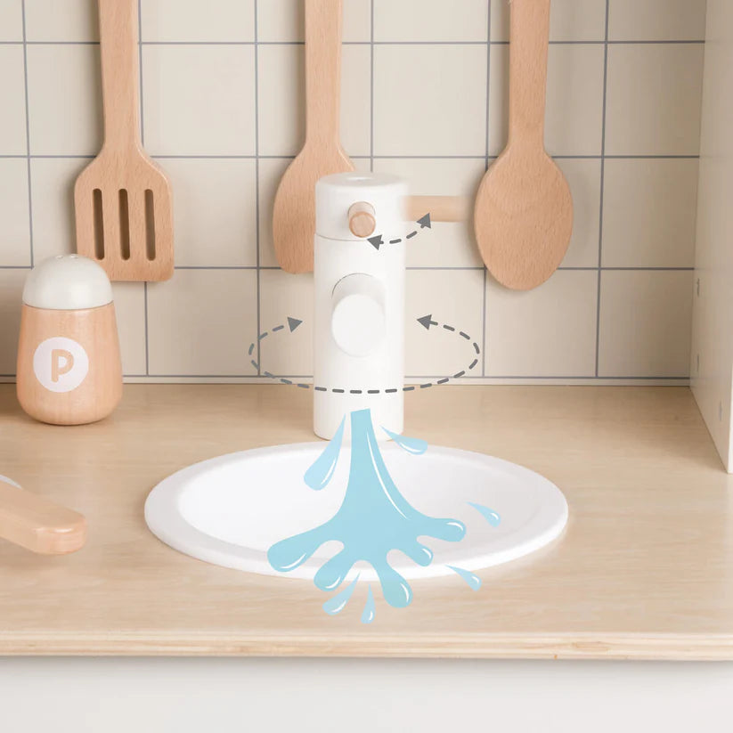 Detalhe do lava-loiça da cozinha Classic World, com a torneira e representação gráfica de água a sair.