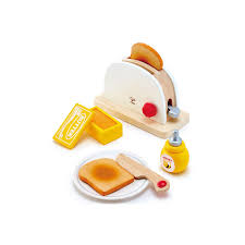 Conjunto completo da Hape Torradeira de madeira com fatias de pão, manteiga, mel, faca e prato, dispostos sobre um fundo branco.