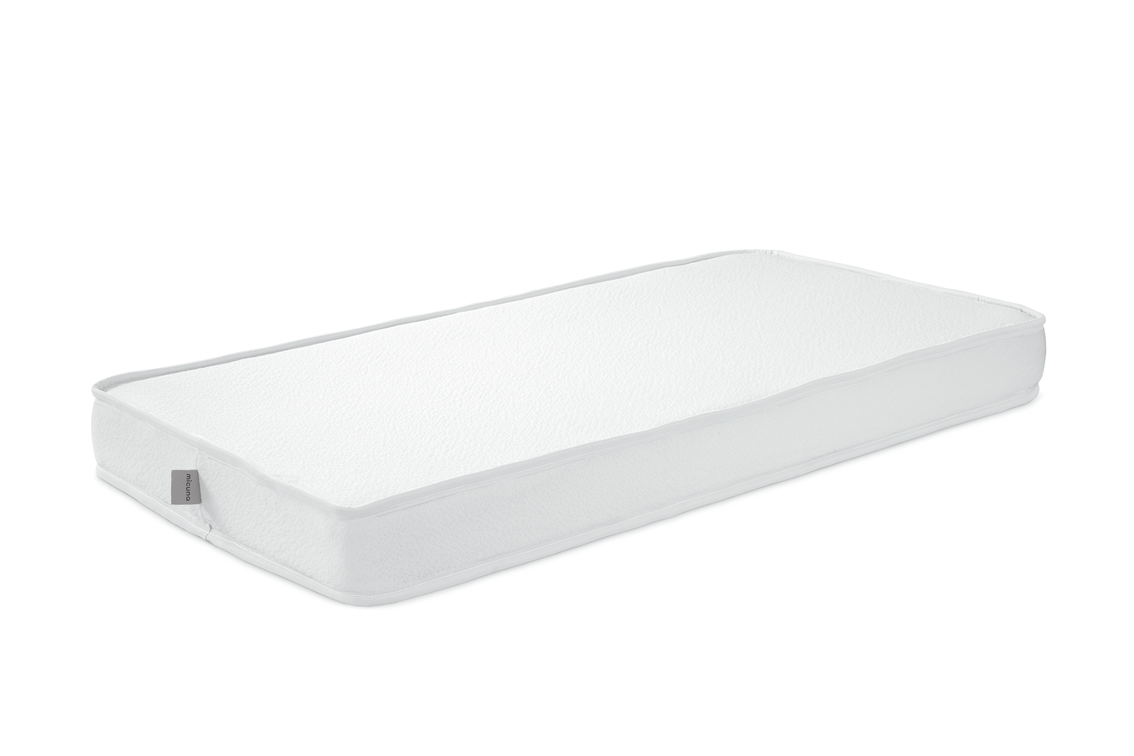 Colchão de espuma Micuna branco, retangular, para berço de 120x60 cm, visto em perspetiva.