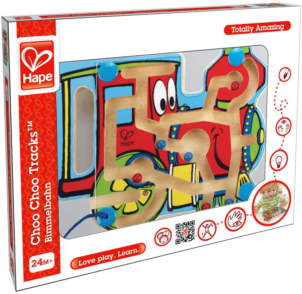Hape Labirinto Comboio na embalagem, mostrando o design do brinquedo, a vareta magnética e a indicação de idade 24M+.