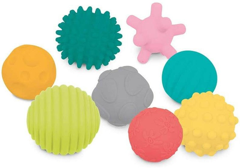 Conjunto de 8 bolas sensoriais Ludi espalhadas, exibindo diversas cores vibrantes e texturas únicas.