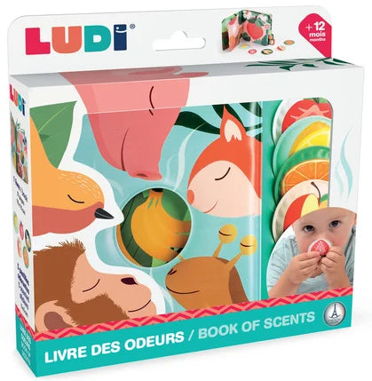 Embalagem do Ludi Livro de cheiros - Frutas, mostrando o livro interativo com peças de frutas e um bebé a cheirar uma morango.