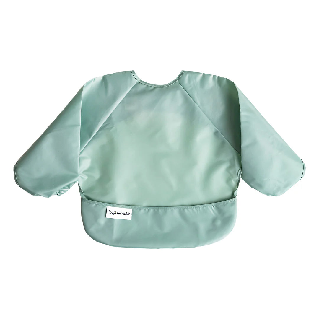 Babete Tiny Twinkle com mangas na cor verde menta, exibido em plano num fundo branco, detalhando o bolso frontal e a etiqueta.