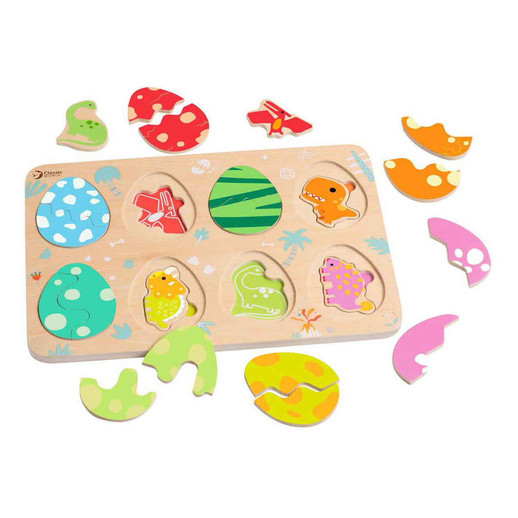 Puzzle de encaixe Classic World Ovos de Dinossauro com as peças coloridas de ovos e dinossauros espalhadas, mostrando o tabuleiro de madeira com os contornos.