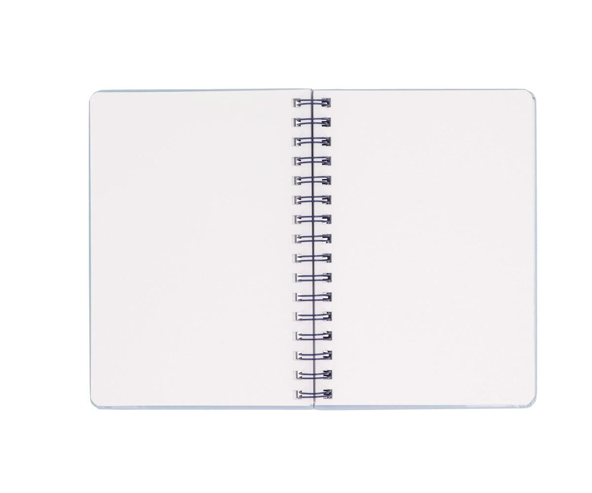 Caderno Escolar Tutete aberto, mostrando as páginas em branco e a encadernação em espiral.