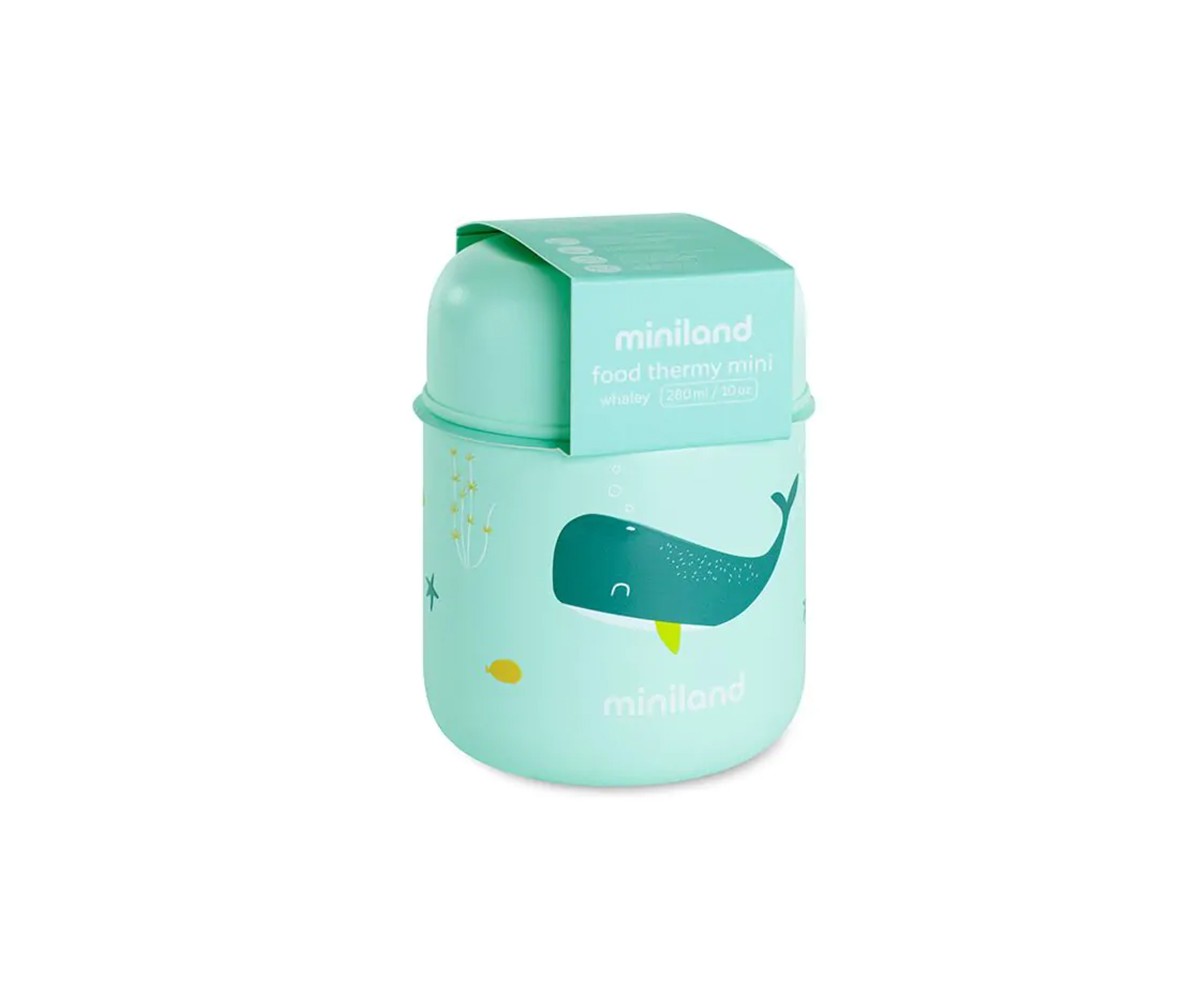 Bebé a ser alimentado com uma colher, com o termo Miniland Whaley 280 ml aberto e um recipiente adicional na mesa.