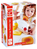 Caixa da Hape Torradeira, um brinquedo de madeira, com criança a brincar e todos os acessórios visíveis, destacando o logótipo Hape e a idade recomendada.