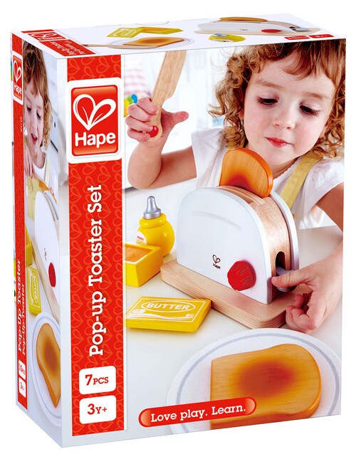 Caixa da Hape Torradeira, um brinquedo de madeira, com criança a brincar e todos os acessórios visíveis, destacando o logótipo Hape e a idade recomendada.