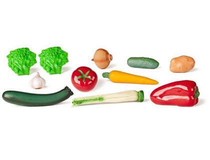 Conjunto de 11 peças de legumes de brincar Miniland, incluindo alface, alho, tomate, curgete, cebola, pepino, batata, cenoura, pimento vermelho e alho-francês, dispostas sobre um fundo branco.