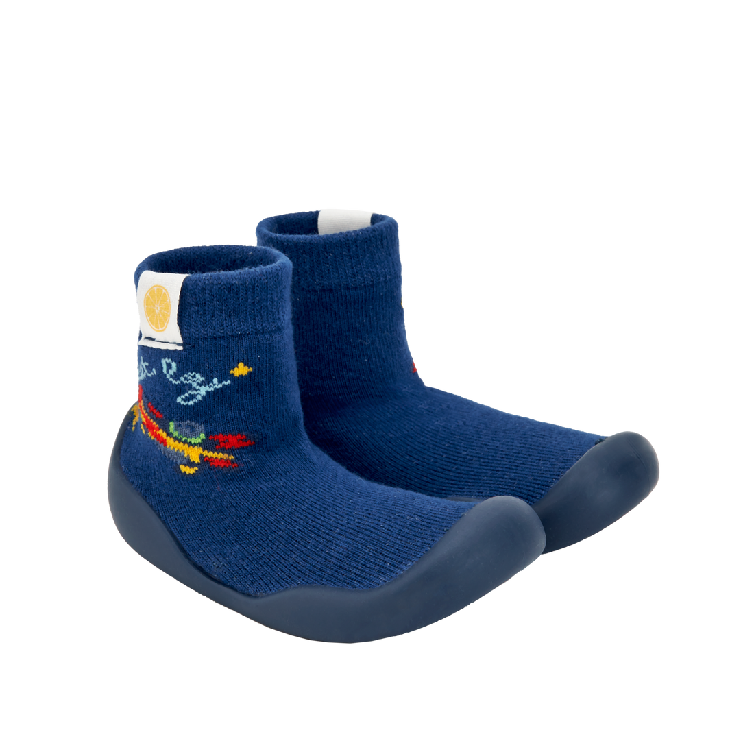 Pantufas tipo meia azul-escuras com sola escura e bordado de foguete, semelhantes às da imagem 2. Ideais para pequenos aventureiros.
