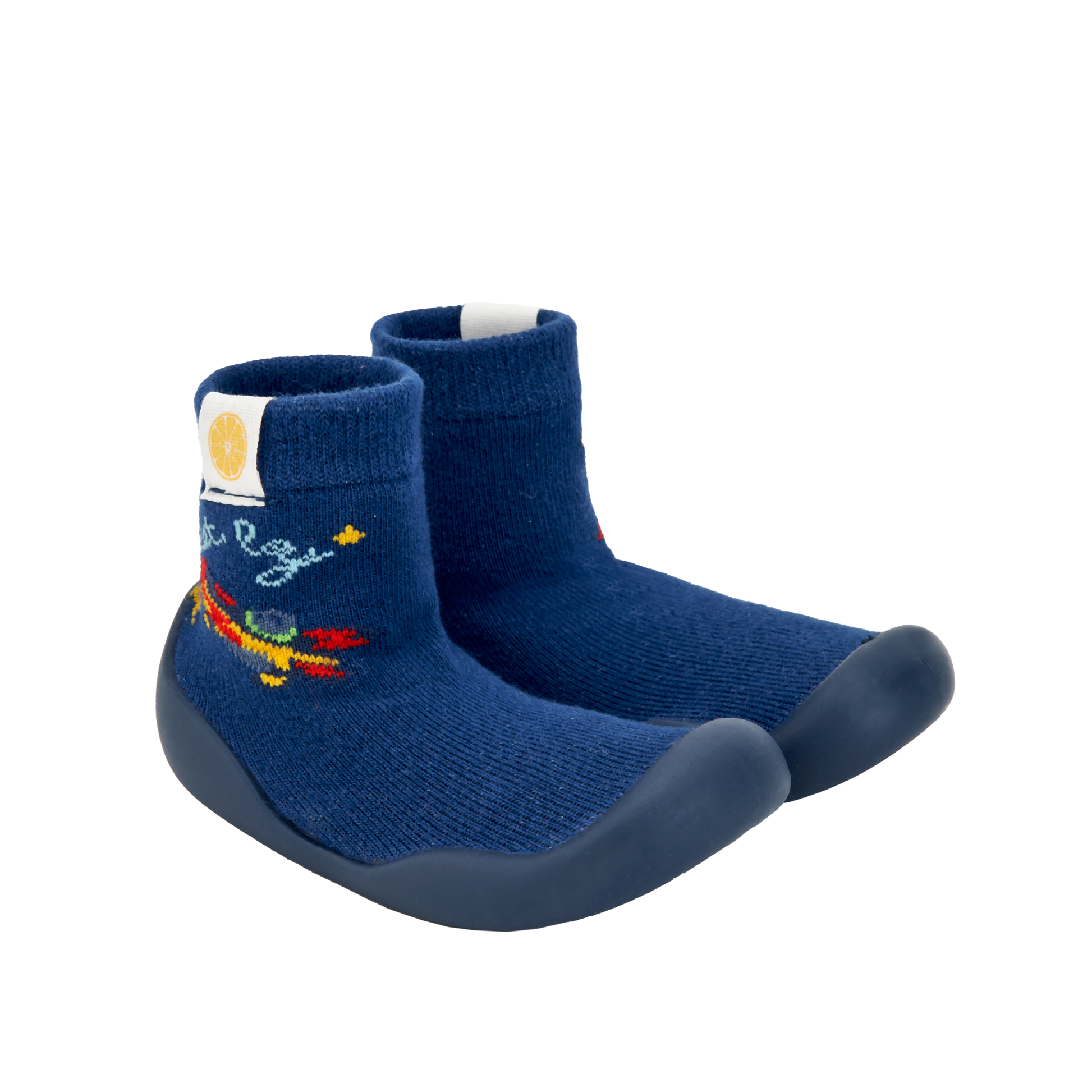 Pantufas tipo meia azul-escuras com sola escura e bordado de foguete, semelhantes às da imagem 2. Ideais para pequenos aventureiros.
