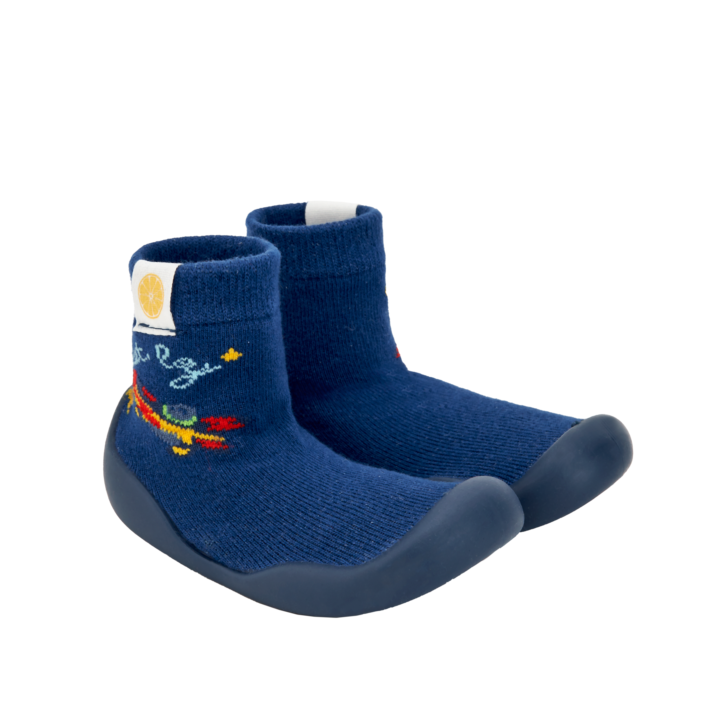 Pantufas tipo meia azul-escuras com sola escura e bordado de foguete, semelhantes às da imagem 2. Ideais para pequenos aventureiros.
