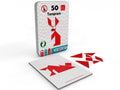 Caixa metálica do jogo Tangram da The Purple Cow com 50 desafios, mostrando as 7 peças vermelhas e um cartão de modelo.