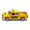 Vista lateral de uma miniatura de carrinha pickup amarela da SIKU, representando um veículo de salvamento da ADAC, com portas e luz de emergência visíveis.