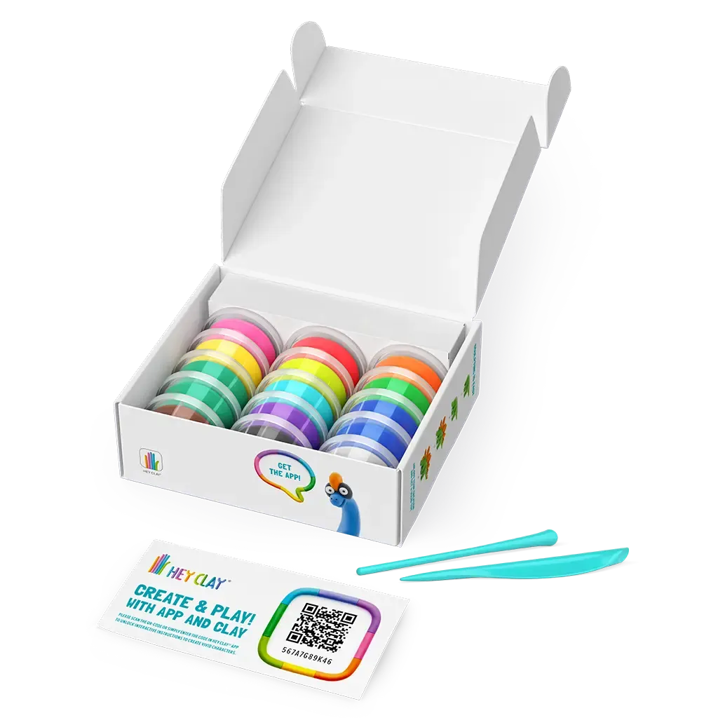 Caixa aberta do HEY CLAY Dinossauros revelando 15 latas de pasta de modelar colorida, duas ferramentas de escultura e um cartão QR para a aplicação.