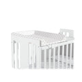 Micuna Trocador de berço de 120x60 com padrão de estrelas cinza, montado num berço branco, mostrando o seu design compacto.
