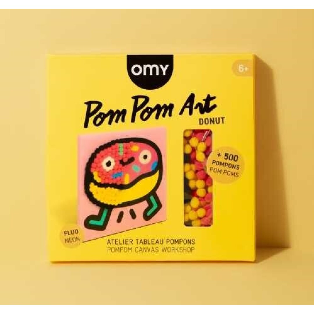 Kit OMY Pintura com Pompons Donut: caixa amarela com a imagem do donut e a indicação de +500 pompons.