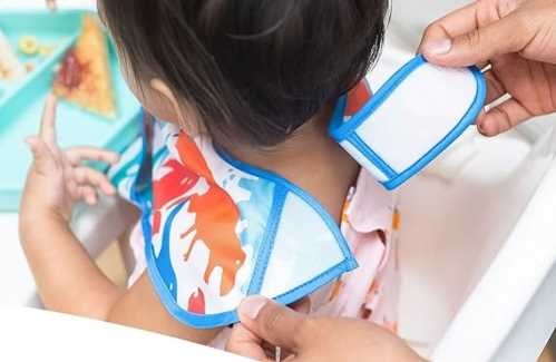 Tiny Twinkle Babete impermeável com bolso em silicone little Bird 6-24m