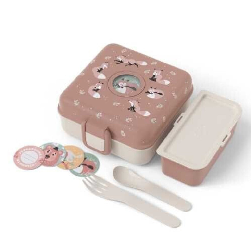 Conjunto completo da Monbento Lancheira para snacks grande Raposa, incluindo a caixa, recipiente interior, talheres e autocolantes personalizáveis.