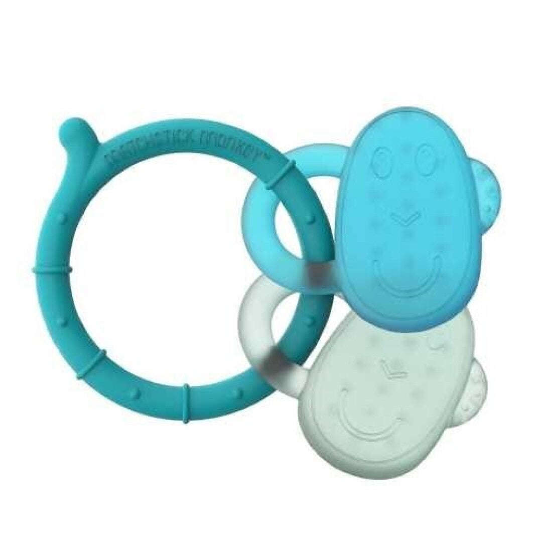 Mordedor Matchstick Monkey em formato de anel e duas cabeças de macaco, nas cores azul turquesa e verde claro, sobre fundo branco.