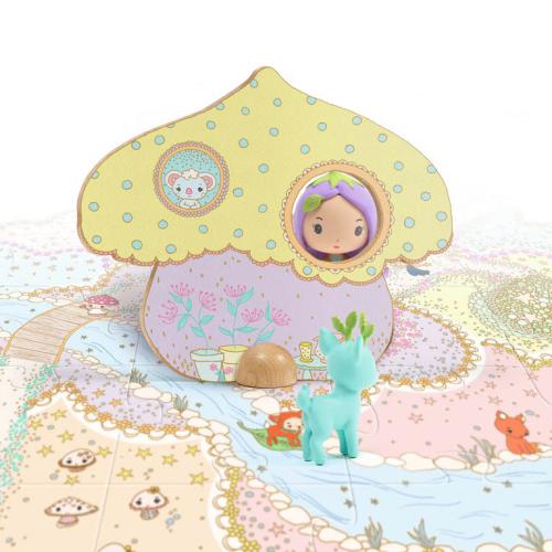 Cenário do puzzle Tinyly Puzzl´Up Lily and Polo montado, com a figura da elfa Lily espreitando de uma casa cogumelo e o veado Polo no chão junto ao rio.