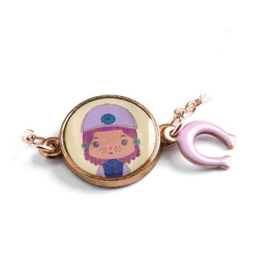 Pulseira Djeco Tinyly dourada com medalhão bege da personagem Tinyly e pendente de ferradura rosa.