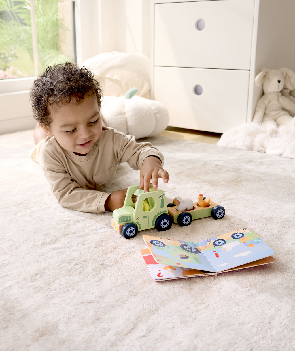 Hape Trator Barulhento e livro