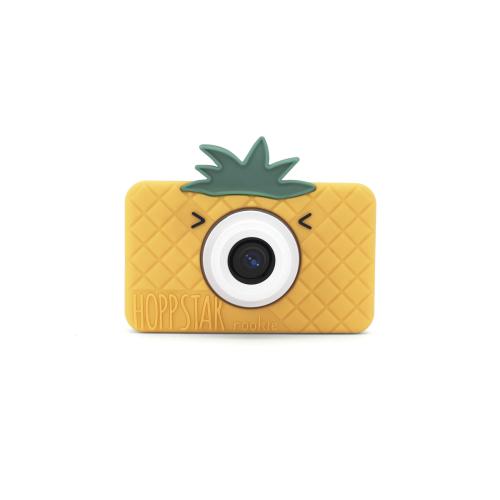 Máquina fotográfica digital Hoppstar Rookie Pina Coolada, vista frontal, com design de ananás amarelo e topo verde.