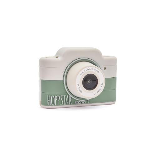 Hoppstar Máquina Fotográfica Digital Expert em ângulo, exibindo o design compacto em verde e branco com a lente.