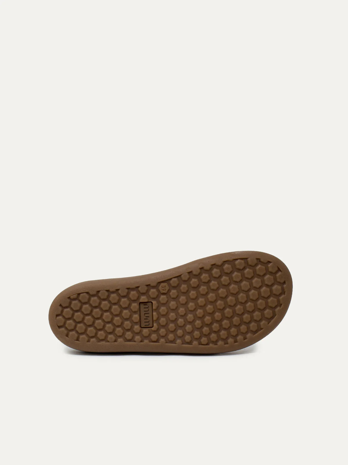 Sola antiderrapante da sapatilha MUM Barefoot Moka More, com padrão hexagonal e logo MUM.