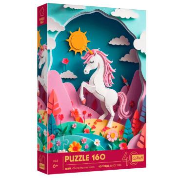 Caixa de um puzzle Trefl com 160 peças, mostrando uma cena 3D de paper art com um unicórnio branco com crina rosa, em pé num campo com flores coloridas e montanhas cor-de-rosa ao fundo, sob um sol amarelo. A caixa destaca o efeito 3D, a marca Trefl e a celebração dos 40 anos.