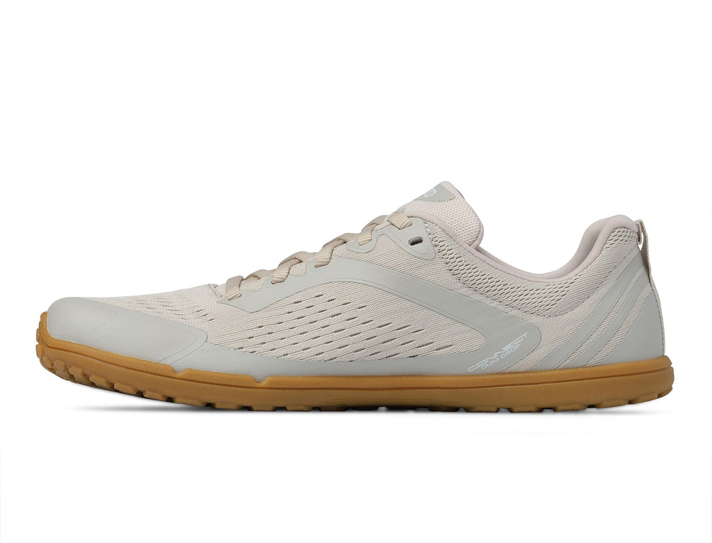 Lado interior da sapatilha barefoot Topo Athletic Connect de mulher em cor cru com sola cor de mel