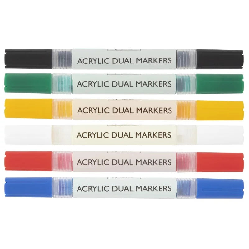 Seis marcadores acrílicos Nassau de ponta dupla, dispostos horizontalmente, em cores como preto, verde, amarelo, branco, vermelho e azul.