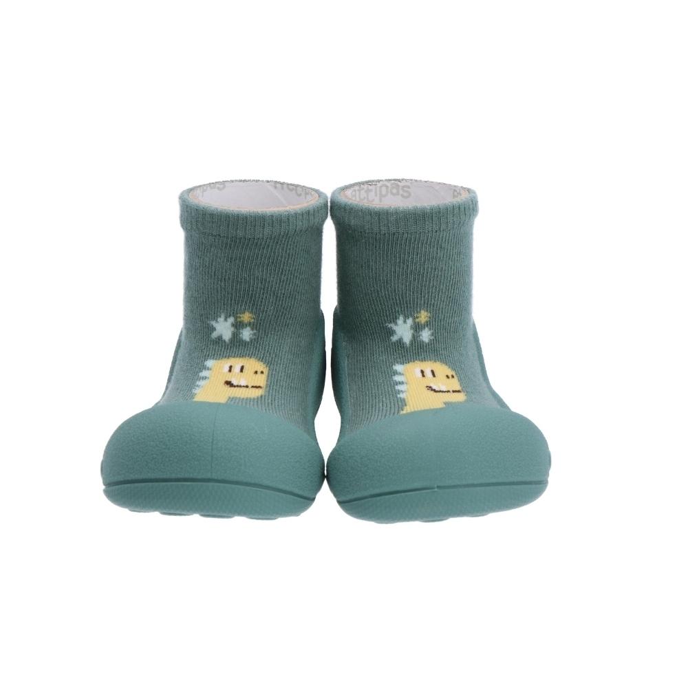 Par de sapatos Attipas DINO GREEN para bebé, com sola verde-água e parte superior verde escura com desenho de dinossauro amarelo, vistos de frente.