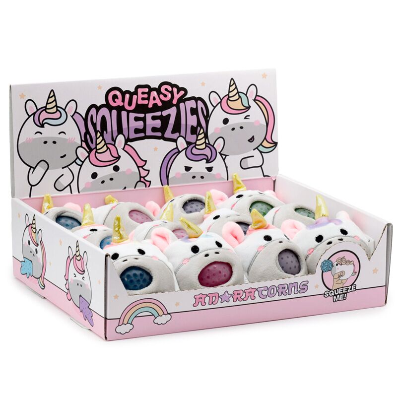 Display box of multiple Adoramals Queasy Squeezies Unicorn plush toys, showing the colorful, textured ball inside the mouth of each unicorn.