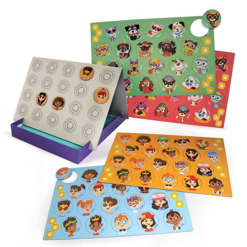 Componentes do jogo "Quem é quem" espalhados: tabuleiros magnéticos (humanos e animais) e vários ímanes de personagens.