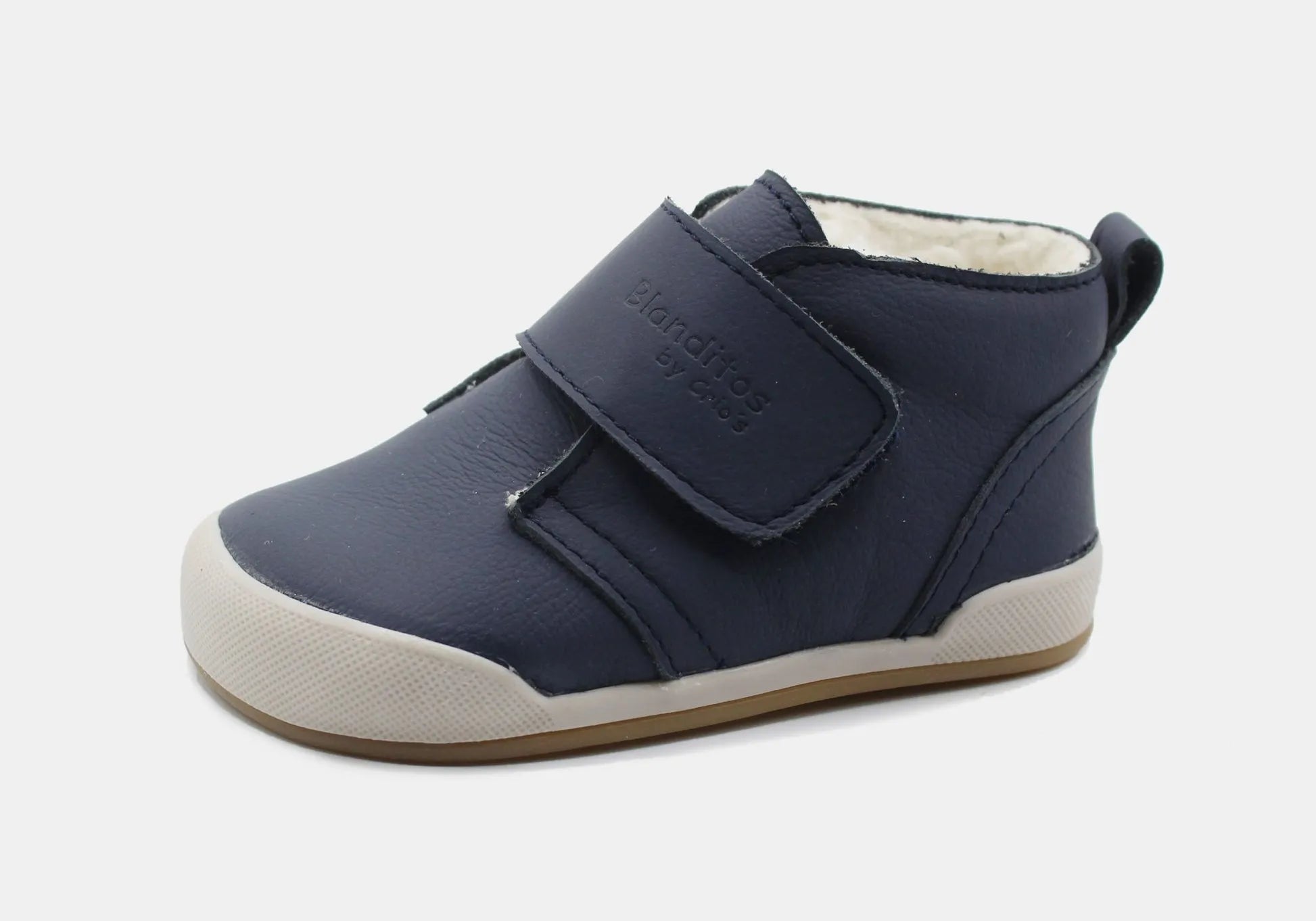 Bota infantil Barefoot Blanditos by Crio's Sidney em pele azul-marinho com fecho de velcro e forro interior felpudo.