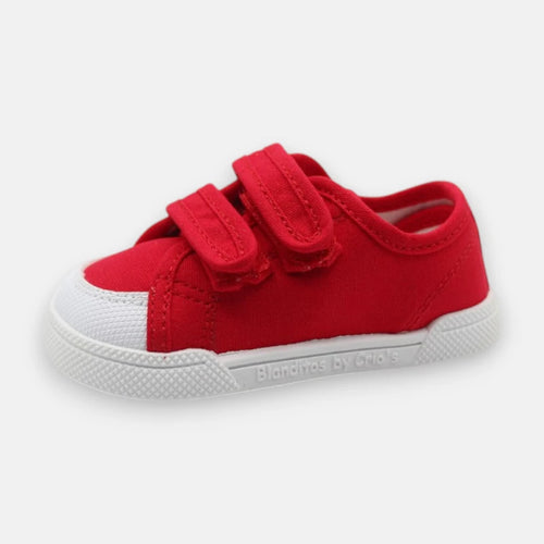 Sapatilha barefoot infantil Blanditos by Crio's, modelo Coco, em lona vermelha com fecho de duplo velcro e sola branca.