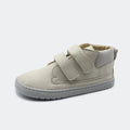 Sapatilha Blanditos Etna cor Ivory (creme/branco sujo), vista de perfil com fundo branco. Calçado Respeitador Barefoot para criança, sola cinza clara flexível e velcro.