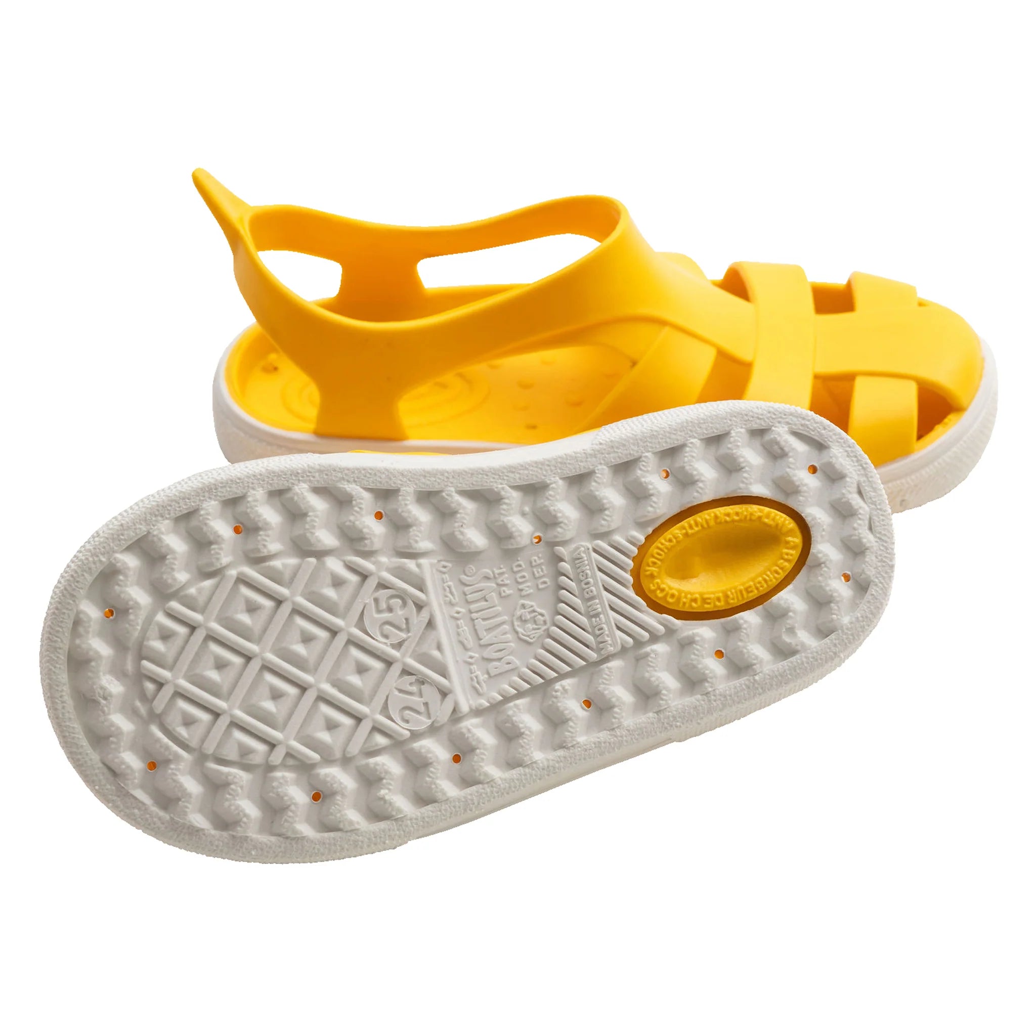 Detalhe da sola antiderrapante e flexível das sandálias barefoot Boatilus Bioty amarelas.