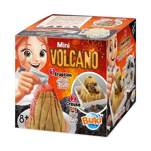 Caixa do kit científico Buki Mini Vulcão, mostrando uma criança a adicionar reagentes para simular uma erupção vulcânica vermelha. Idade 8+.