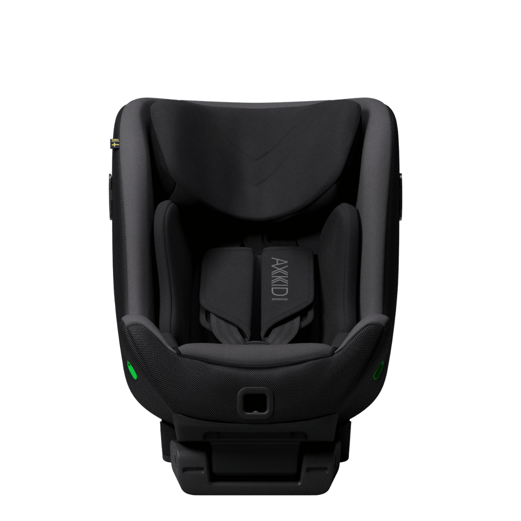 Vista superior da cadeira auto Axkid Minikid 4 PRO preta, mostrando o assento profundo, arnês de 5 pontos e apoios laterais interiores.