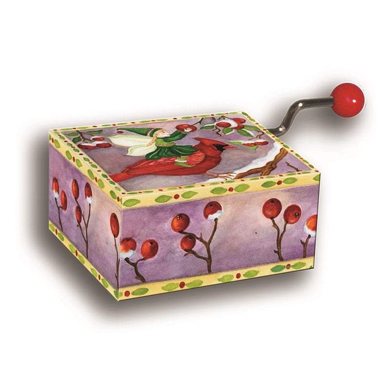 Caixinha de música de Natal com ilustração de um pássaro vermelho e uma fada num cenário invernal, com manivela para tocar a melodia.