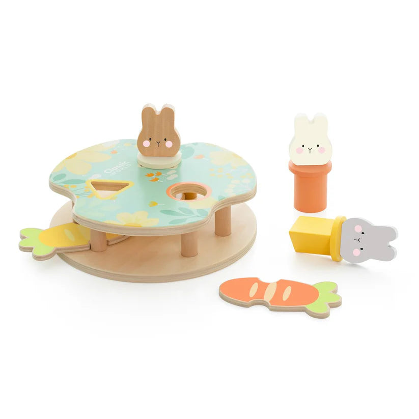 Visão geral do Jogo de encaixe dos Coelhos Classic World mostrando todas as peças: coelhos, cenouras e a base com encaixes.