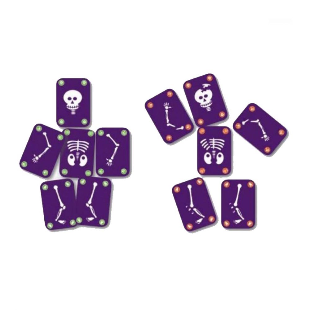 Várias cartas do jogo Djeco Bogoss espalhadas, mostrando partes de esqueletos e crânios.