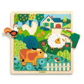 Puzzle de madeira Djeco com 15 peças representando uma quinta com animais como galo, vaca e ovelha.