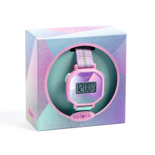 Djeco Relógio Digital para criança em caixa de cartão colorida com tons pastel e mostrador rosa/azul.