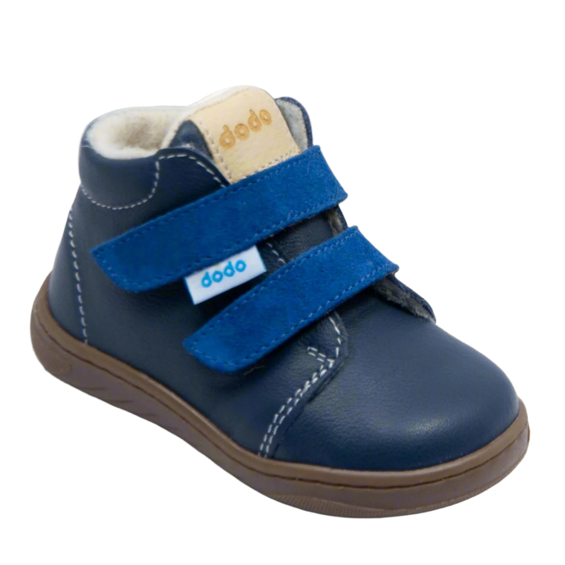 Botas barefoot Dodo Shoes em azul marinho, com interior em lã e palmilha em merino, fecho em Velcro duplo para um ajuste seguro e sola flexível para um desenvolvimento saudável dos pés infantis.