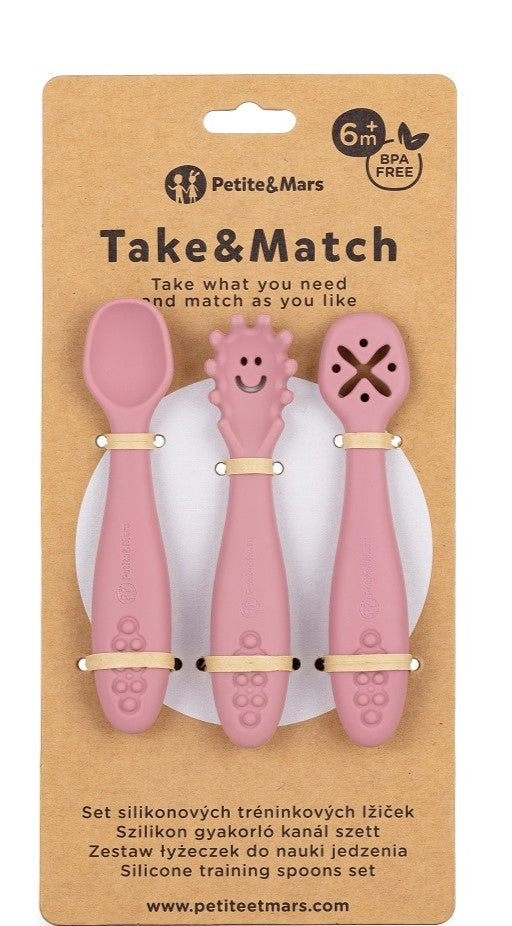 Embalagem de cartão da marca Petite&Mars com três colheres de treino cor-de-rosa visíveis, indicando 6m+ e BPA Free.